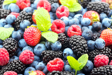 Berries. Various colorful berries background. Strawberry, raspberry, blackberry, blueberry closeup. Healthy eating