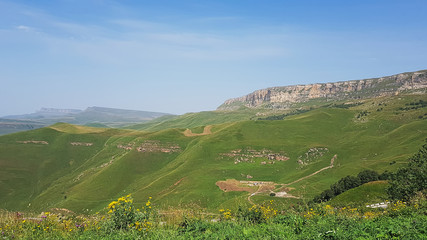 Fototapeta premium Gumbashi pass view in the russian caucasus, green meadow landscape at an altitude of above 2000 m