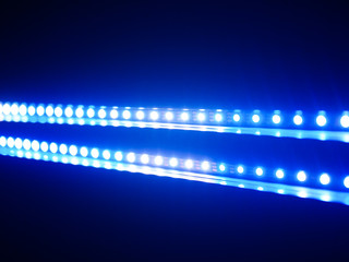 close up on blue LED light in black background