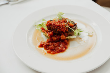 close up on stuffed baked mushroom, portabello