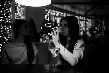 The girl in the evening in a cafe