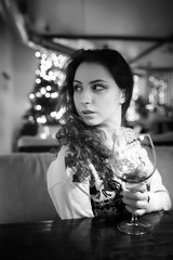 The girl in the evening in a cafe