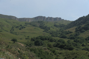 Fototapeta premium Gumbashi pass view in the russian caucasus, green meadow landscape at an altitude of above 2000 m