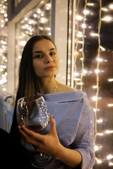 The girl in the evening rest in a cafe