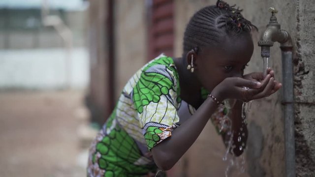 Gorgeous African School Child Girl Woman Drinks Fresh Clean Water