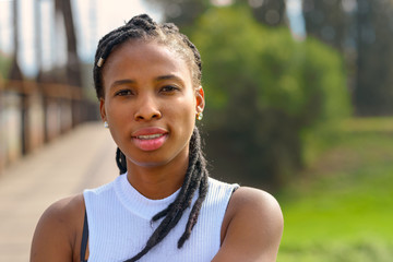 Thoughtful young African woman with a quiet smile