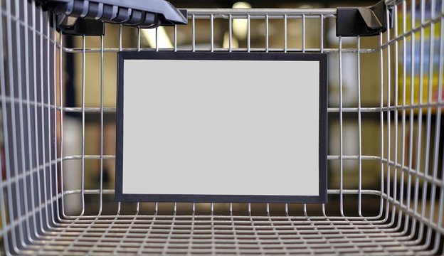 Closeup of a advertising sign in a Shopping cart. Horizontal image with copy space.