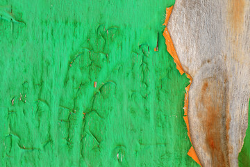 Background image of close up peeled gren color textured wooden building exterior surface