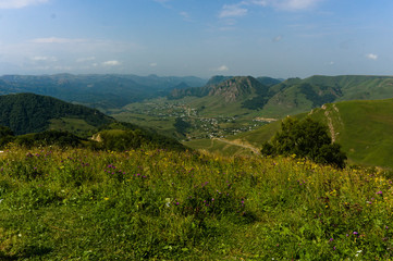 Gumbashi pass view in the russian caucasus, green meadow landscape at an altitude of above 2000 m