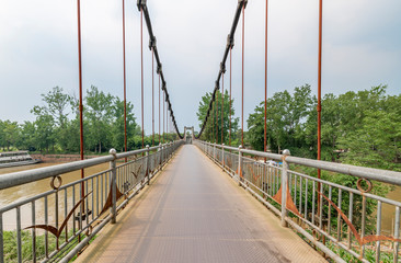 Obraz premium Iron rope suspension bridge in the ancient town of Huanglongxi, Chengdu, Sichuan Province, China