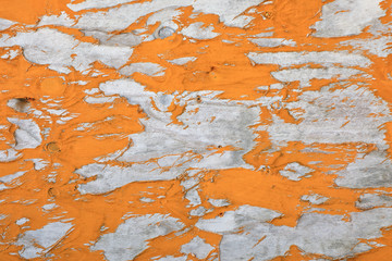 Background image of close up peeled orange color textured wooden building exterior surface