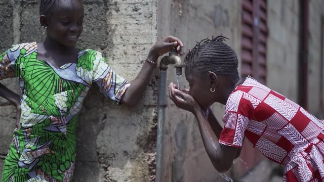 Human Rights Issues, Black Girls Drinking Fresh Water from tap