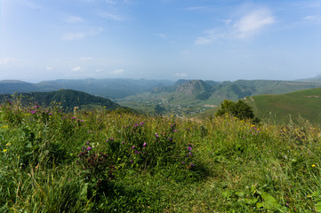 Gumbashi pass view in the russian caucasus, green meadow landscape at an altitude of above 2000 m