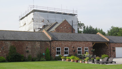 Large Yorkshire harm house with extensive scaffolding