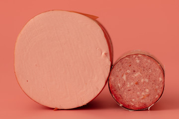 Meat sausage on a pink background
