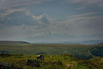 Gumbashi pass view in the russian caucasus, green meadow landscape at an altitude of above 2000 m
