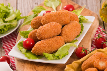 Supplì, italian fried rice balls.