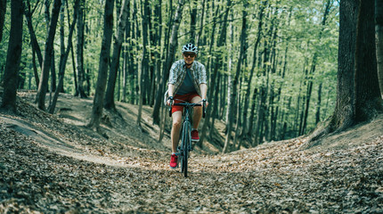 Fototapeta premium Men is riding on bicycle.