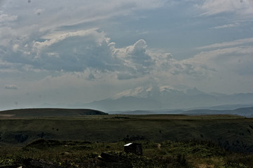 Gumbashi pass view in the russian caucasus, green meadow landscape at an altitude of above 2000 m