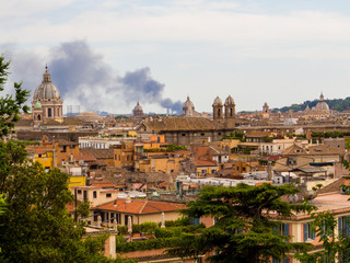 Fototapeta na wymiar Summer fire in Rome, Italy