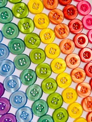 Lines of coloured plastic buttons