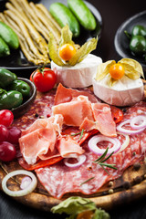 Serrano ham platter with variation of appetizers