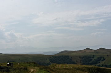 Gumbashi pass view in the russian caucasus, green meadow landscape at an altitude of above 2000 m