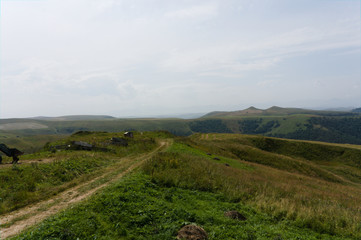 Gumbashi pass view in the russian caucasus, green meadow landscape at an altitude of above 2000 m