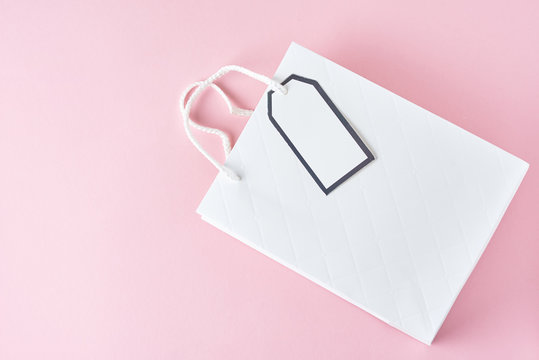 White Shopping Bag On Pink Background, Top View