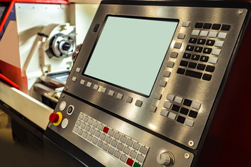 CNC equipment. The control panel of the machine. Computer management in industry. Modern turning...