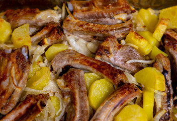 roast with pork ribs and baked potatoes