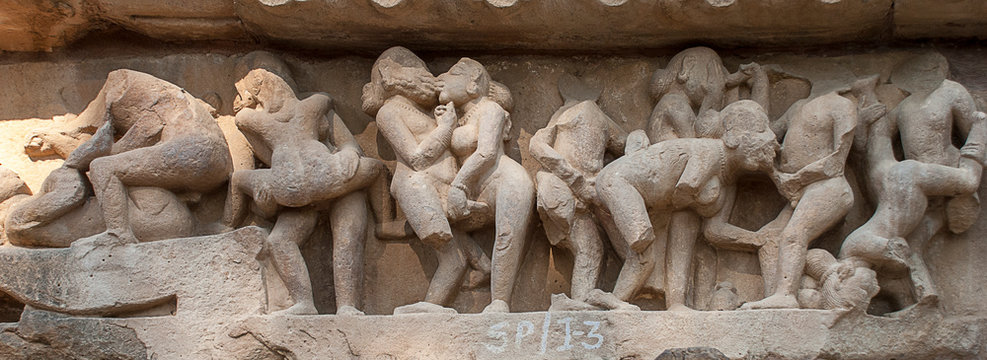 Erotic sculptures on the walls of famous Khajuraho Temples in India. Khajuraho Temples are one of the UNESCO World Heritage Sites in India. The temples are famous for their Nagara-style architectural 