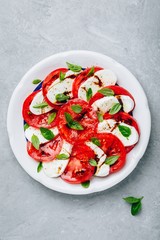 Tomato, basil, mozzarella Caprese salad with balsamic vinegar and olive oil.