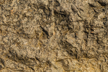 Rock plate. Colored stone surface. Wall of the house. Geology and Metamorphic rocks.