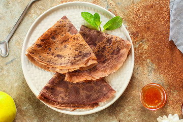 pancakes  chocolate (fritter with cocoa, delicious breakfast dessert) menu concept. food background. copy space. Top view