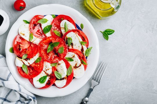 Tomato, basil, mozzarella Caprese salad with balsamic vinegar and olive oil.