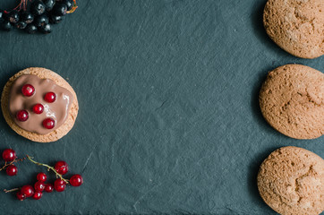 Oatmeal cookies on a dark background top view flat lay