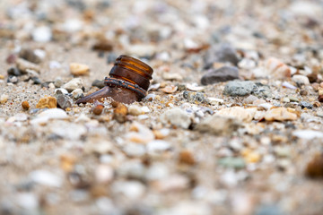 Closeup image of broken bottles on the beach