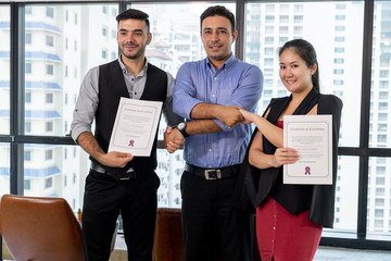 Happy young team handshake job applicant make business deal at meeting