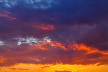 Naklejka na ściany i meble Sunset with clouds, in orange and purple shades