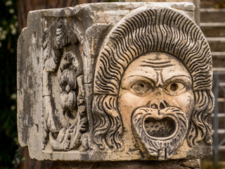 Mask detail, Roman Theater, Ancient Archaeological Site of Ostia Antica in Rome, Italy