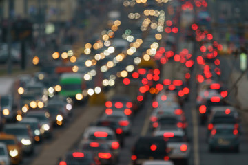 Blurred photography of cars motion. Big traffic in city. In the summer urban highway filled cars....