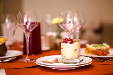 Tasty dessert with berries on dinning table