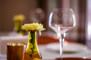 Small vase with flower on dinning table