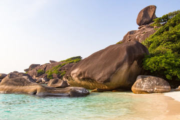 Thailand. Phuket. Similan Islands. Stones on the shore of the Andaman sea. The stone sail.  Seascape of Thailand. Rest on the beach. White sand on the shore. Clean water of the Andaman sea.