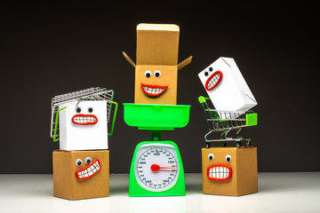 Emodji boxes. Parcels awaiting dispatch. Boxes have the angry face. Boxes are jealous of the parcel on the scales. Slow operation of the post office.