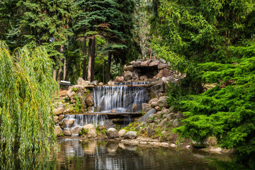 Landscape Park With Waterfall In Warsaw