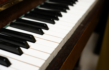 Close up frontal view of piano keys. Learning to play a musical instrument.