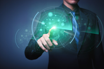 The abstract image of businessman throwing a dart to futuristic target hologram - Image