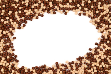 Frame of chocolate corn flakes  isolated on white background.